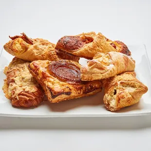 a plate of pastries on a white table