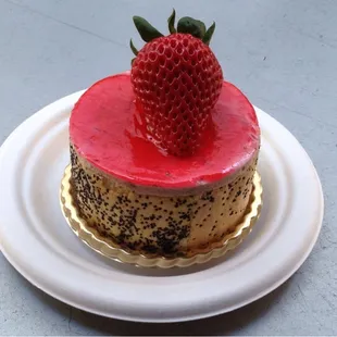 Strawberry Charlotte strawberry mousse wrapped in poppy seed basil ladyfinger cake  with dried strawberries