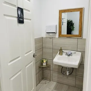 a bathroom with a sink and mirror