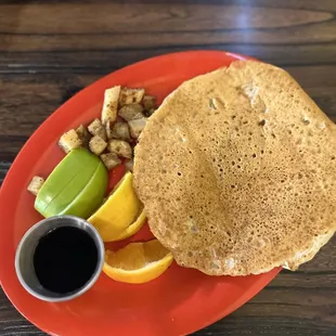 Pancake, fruit, and potatoes