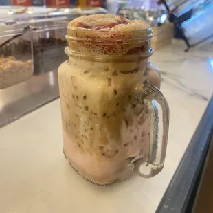 a jar of ice cream and a cookie