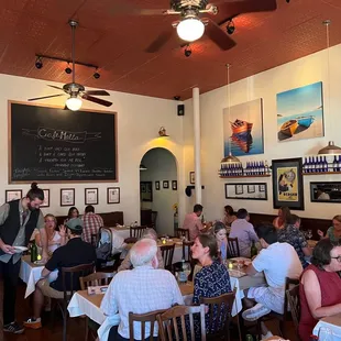 a large group of people sitting at tables