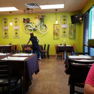a man sitting at a table in a restaurant