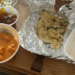 Yummy butter chicken, garlic naan, mango chutney and rice!