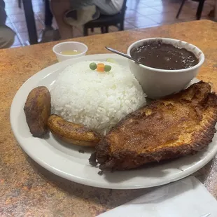 Fried fish ,rice,Black Beans,plaintanes