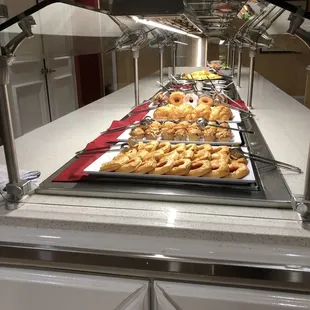 a buffet with a variety of pastries