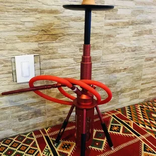 a red hook on a stand