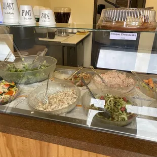 All the different salads at the take out counter