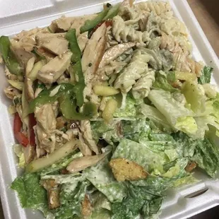 a salad in a styrofoam container