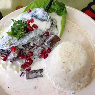 Chile en nogada vegefied! Filling is chipotle mushrooms. Delicious! Too bad it&apos;s seasonal.