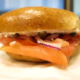 Smoked salmon with low fat cream cheese, onions and capers on a toasted wheat bagel.