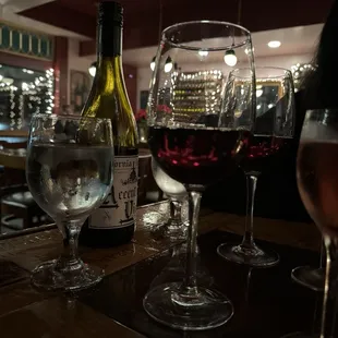 a glass of wine and a bottle of wine
