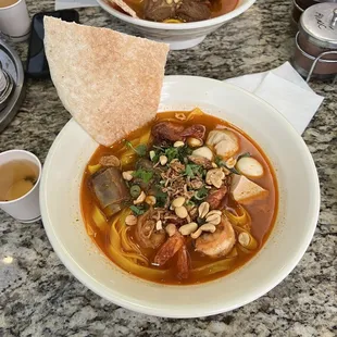 Yummy Mi Quang noodles, not too spicy like BBH and includes variety of meat / seafood