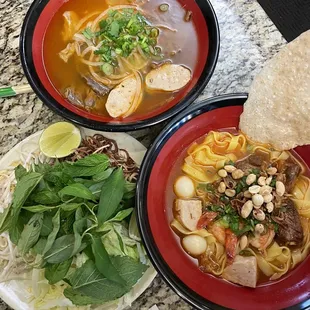 bun bo bue (top) mi quang with pork and shrimp (bottom)