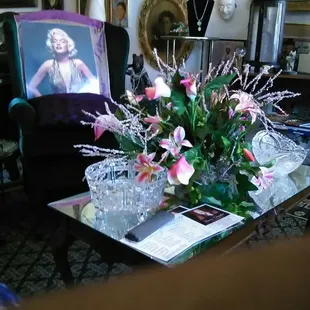 a table with a vase of flowers on it