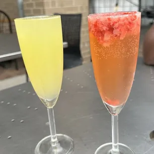 Fresh squeezed strawberry and orange mimosas