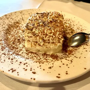 a dessert on a plate with a spoon