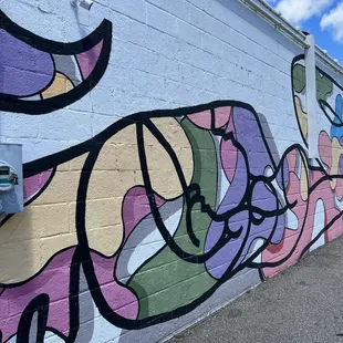a colorful mural on the side of a building