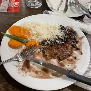 Rice, vegetables and black beans with a small piece of meat