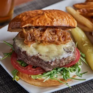 a burger and fries on a plate