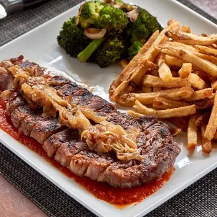 a steak and french fries on a plate