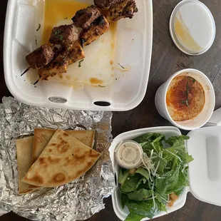 This is their meal for $24 bucks. 2 sticks of kebabs, humus, 3 pieces of bread and small salad.