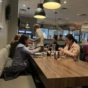 a group of people sitting at a table