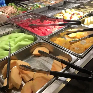 a variety of salads in a buffet