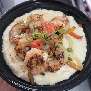 a plate of shrimp and grits