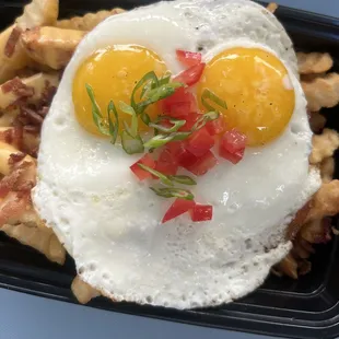 two fried eggs on top of a waffle