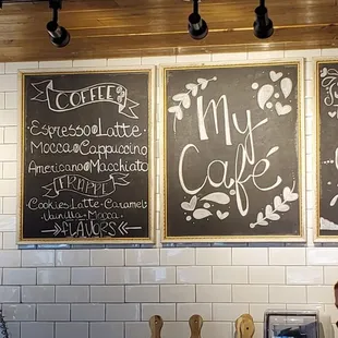 menus on the wall above the counter