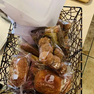 a basket of bread and pastries