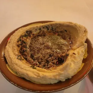 Bubbling ground lamb over hummus