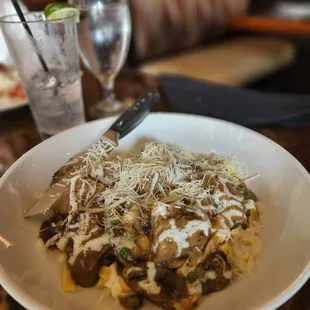 Steak over pasta entree