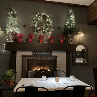 a dining room with a fireplace