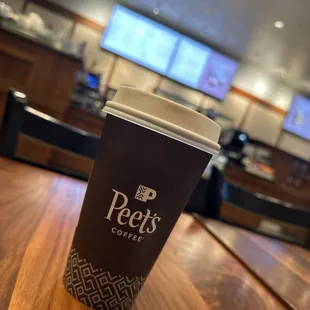 a coffee cup on a wooden table