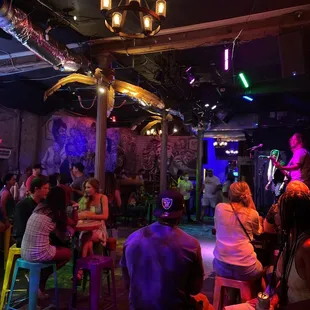 a group of people sitting at a bar