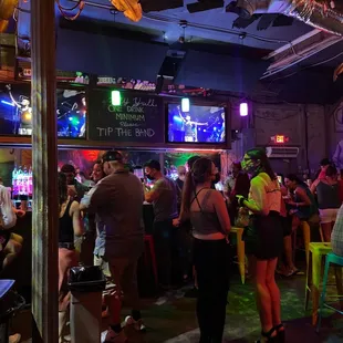 a crowd of people at a bar