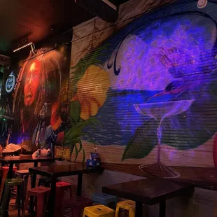 a mural of a woman with a flower in her hair