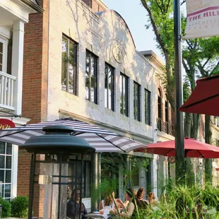 a row of tables and umbrellas