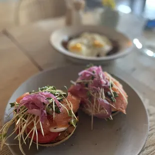smoked salmon bagel, salmon, hard-boiled egg, pickled onion, tomato, caper scallion cream cheese, everything bagel