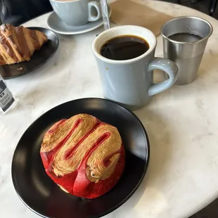 Back: Butter Croissant and Mocha Front: Raspberry Croissant Bun and Drip Coffee