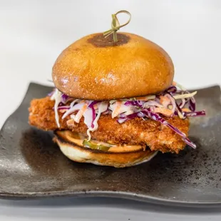 Fried chicken sandwich with chipotle aioli, cole slaw and house pickled jalepenos