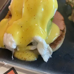 a plate of eggs benedict