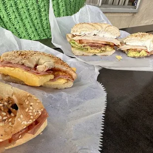 Ham egg and cheese bagel, and a California bagel with avocado, tomato, bacon, turkey, cream cheese