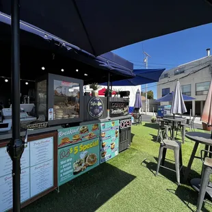 outdoor seating area with tables and umbrellas