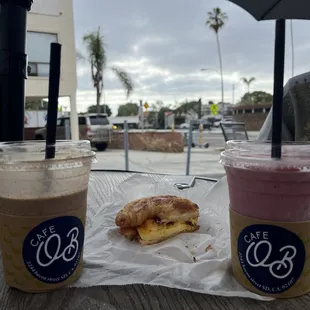 two drinks and a pastry on a table