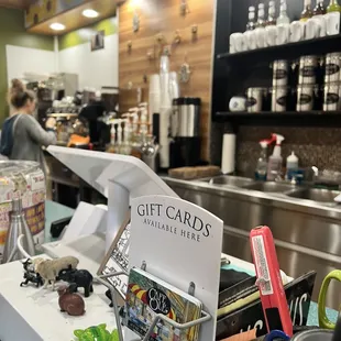 a counter with gift cards on it