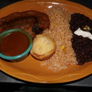 Chile Relleno stuffed with cheese (called Queso Relleno on the menu) with chile colorado, rice, black beans, and jalapeño cornbread