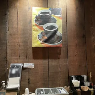 a painting of three cups of coffee